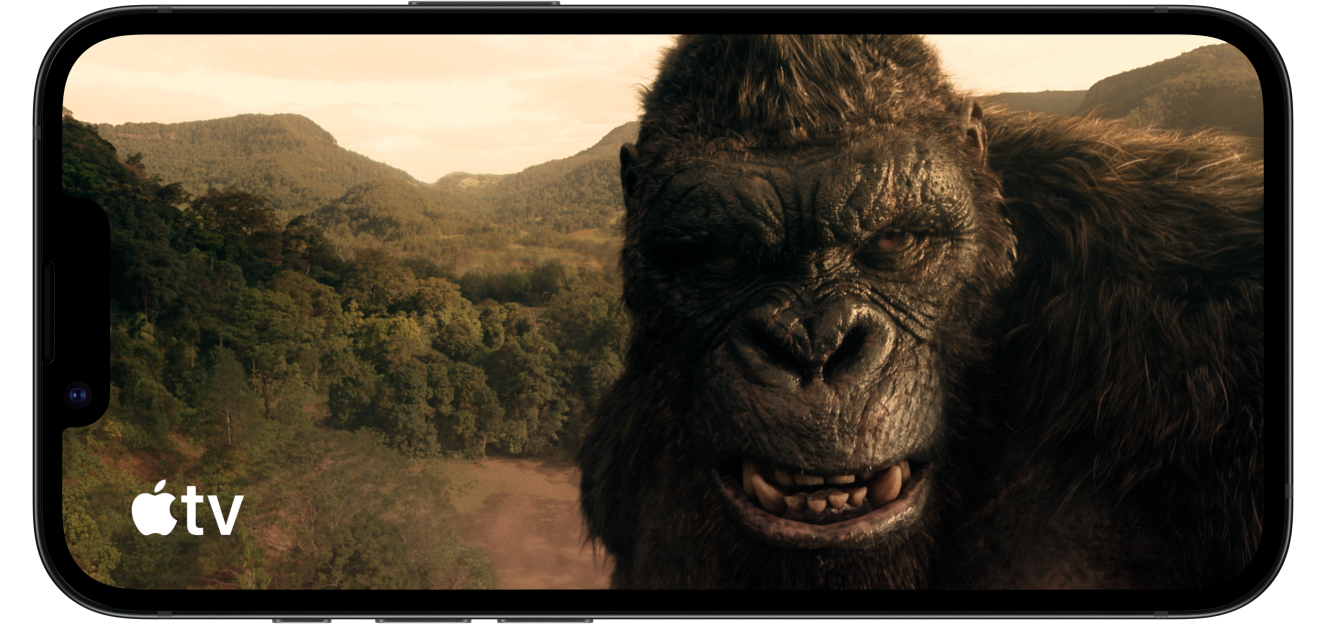 iPhone 17e showing a game being played, then rotating to show an a television show featuring King Kong on Apple TV.
