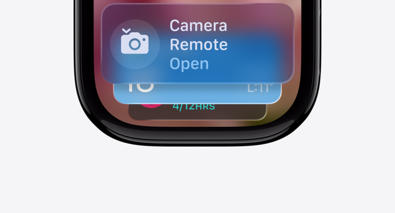 Apple Watch in Jet Black with no band, face shows the Smart Stack hint indicator