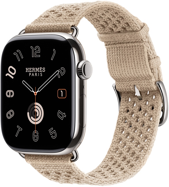 Apple Watch Hermès Series 11, titanium case, silver color, polished finish, edge-to-edge display, rounded corners, right side exterior, Digital Crown, microphone, side button, analog watch face (hour, minute, second hands), paired with Néo Tricot band, argile color (beige), knit polyamide yarn material, adjustment holes centered, silver color buckle and hardware