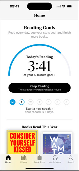 iPhone screen showing the Reading Goals interface in the Books app. At the top, there is a progress ring. Below the progress ring is the weekly reading streak tracker. At the bottom is the Books Read This Year section, which includes a row of two books, with an empty slot for a third.