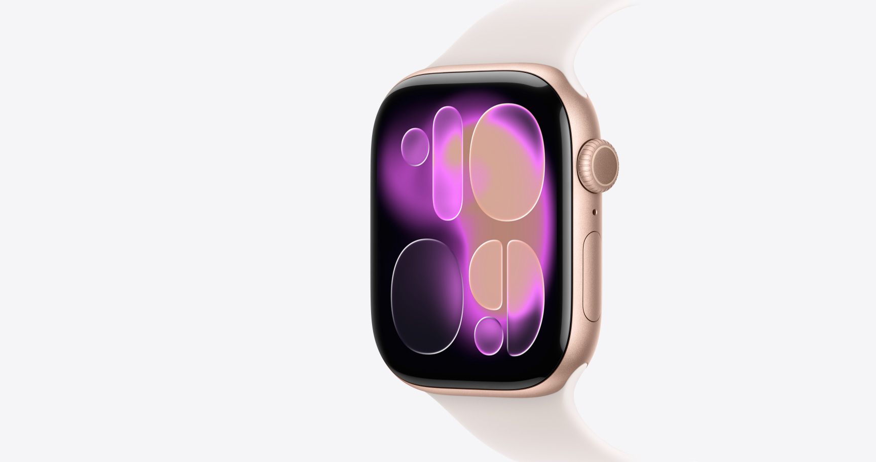 Apple Watch Series 11, rose gold color, aluminum case, Responsive Art watch face, right side exterior, Digital Crown, microphone, side button, Sport Band, light blush color