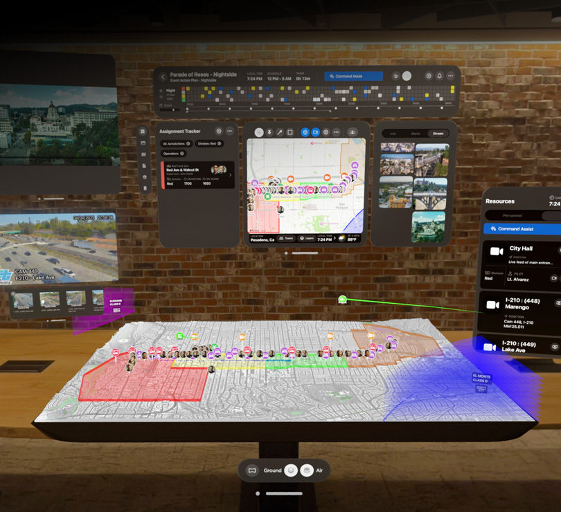 Multiple digital dashboards float with aerial views of Pasadena, a 3D map of the city, live video feeds and resourcing plans